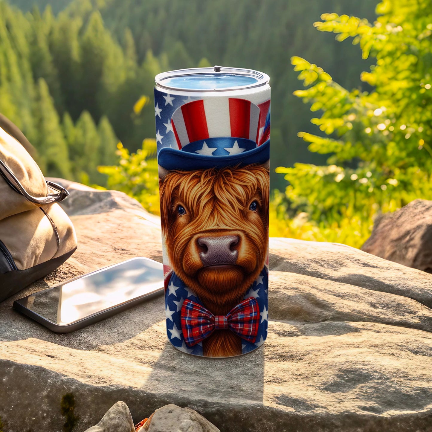 Highland cow in patriotic hat and bowtie on a tumbler.