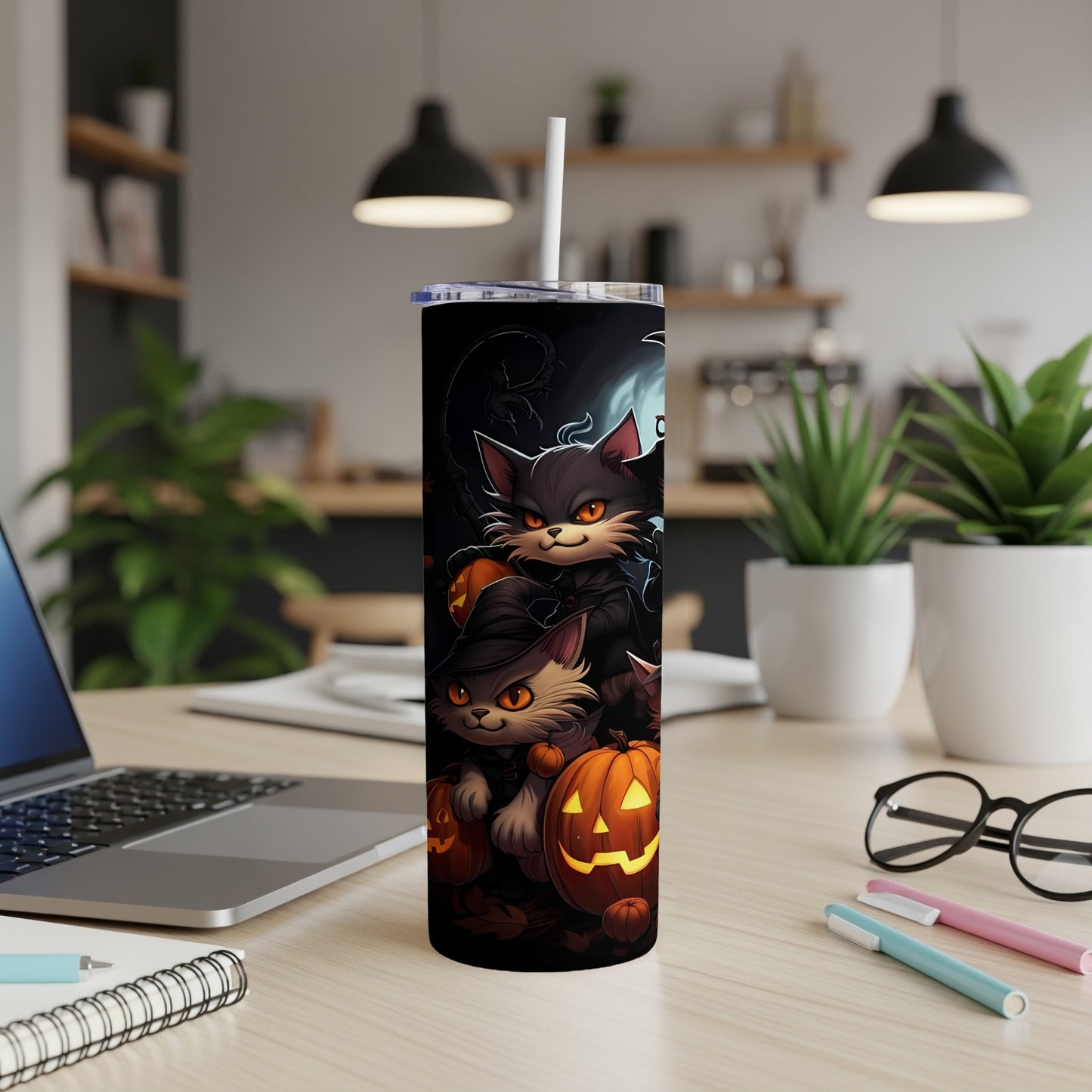 Halloween tumbler with cartoon cats and jack-o'-lanterns.