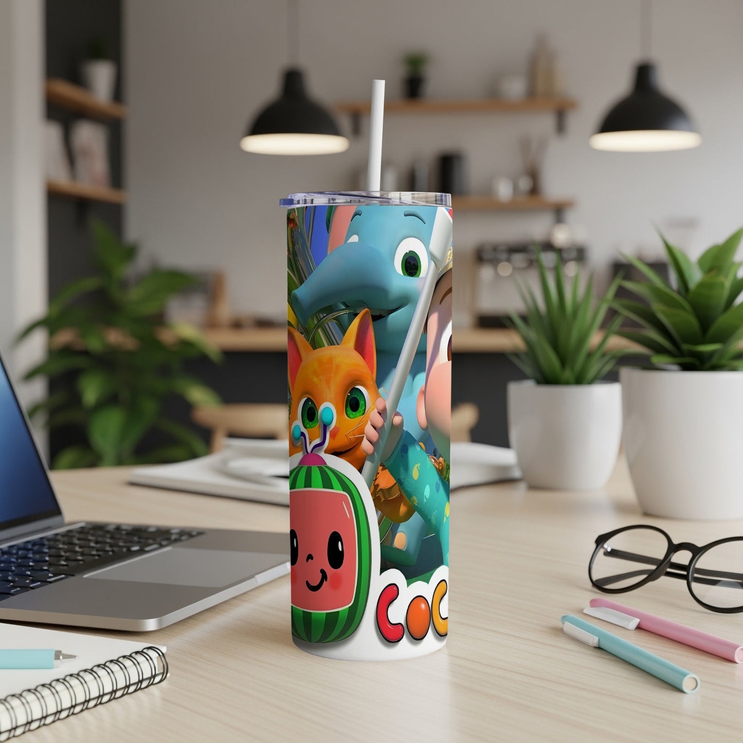 Cocomelon characters on a white tumbler with a straw, on a desk.