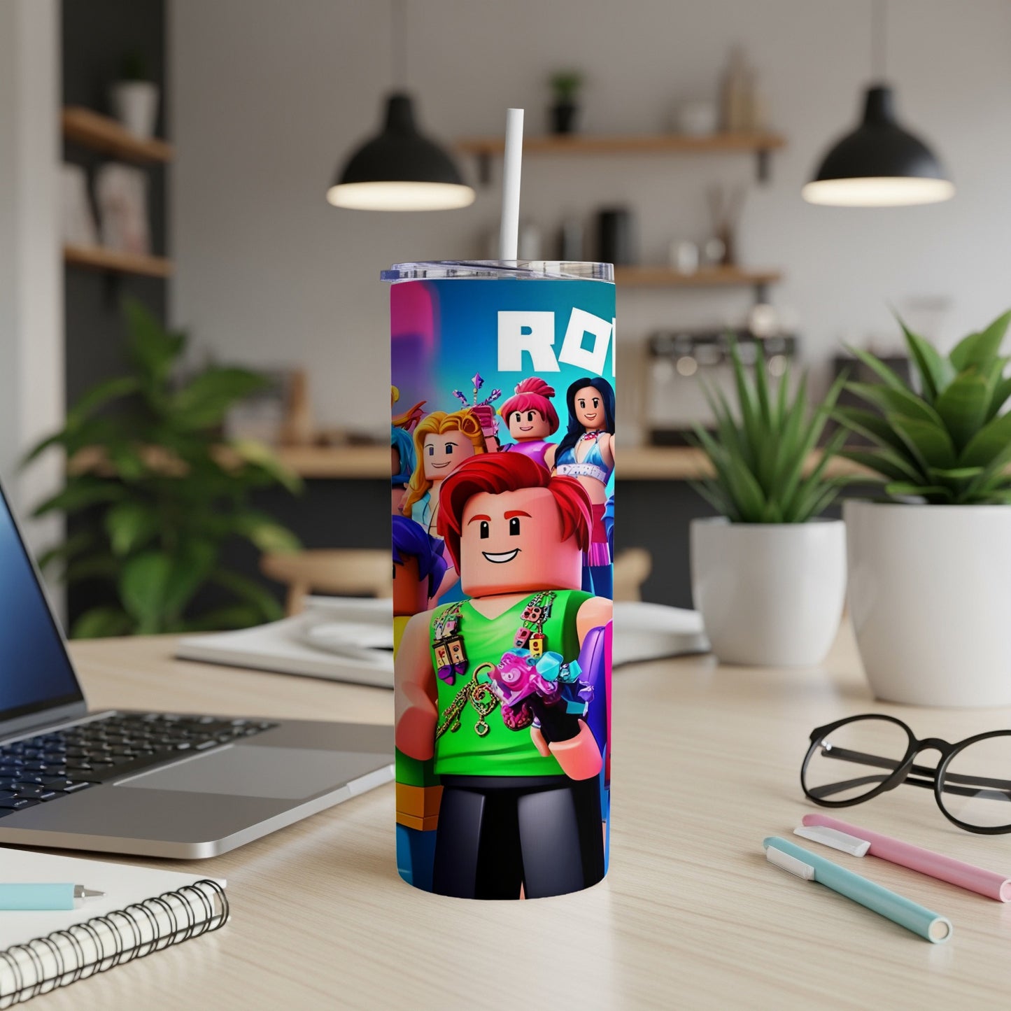 Roblox character tumbler with straws and flowers, on a desk.