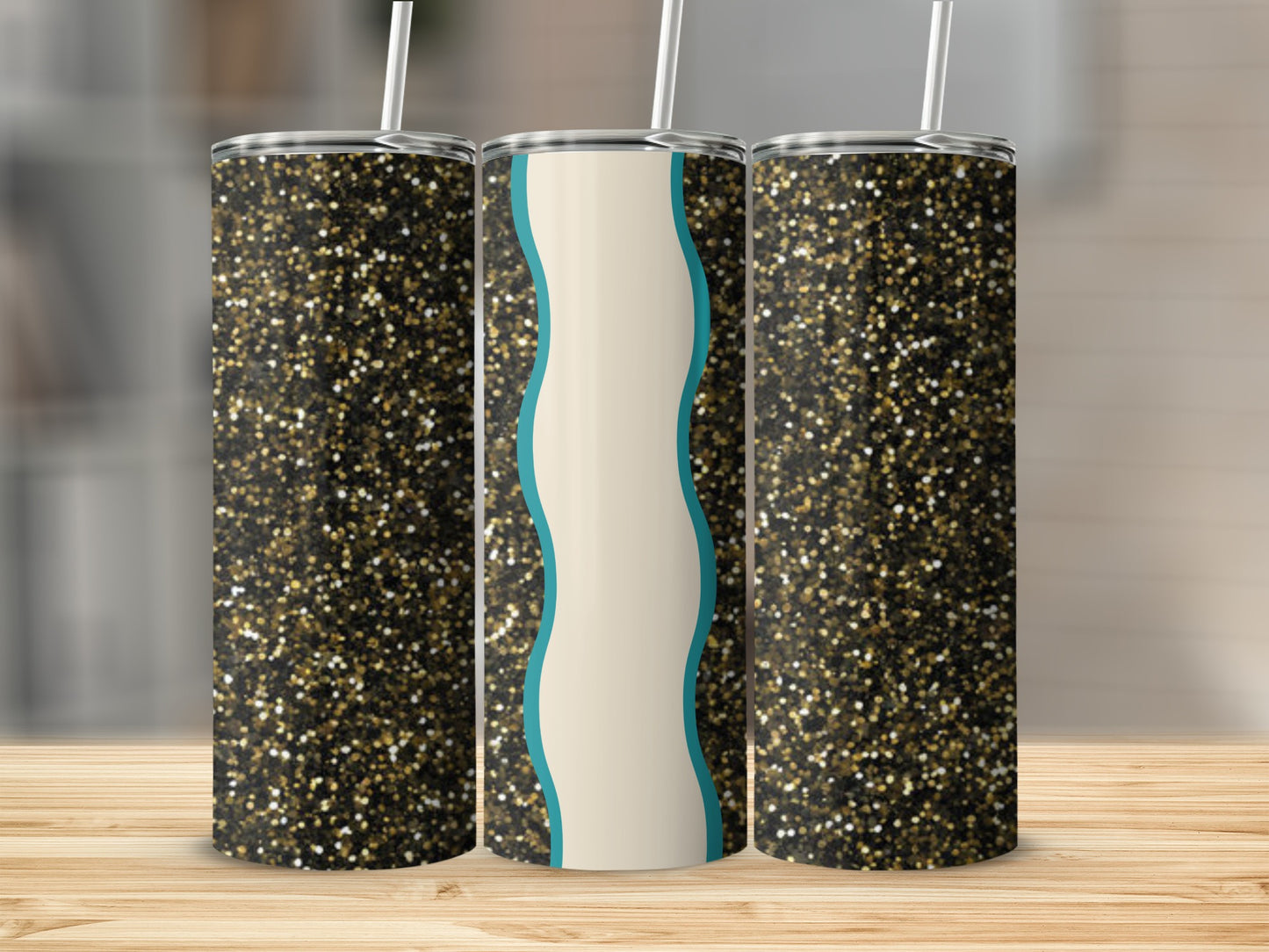 Three glitter-covered tumblers with teal and cream wavy designs.