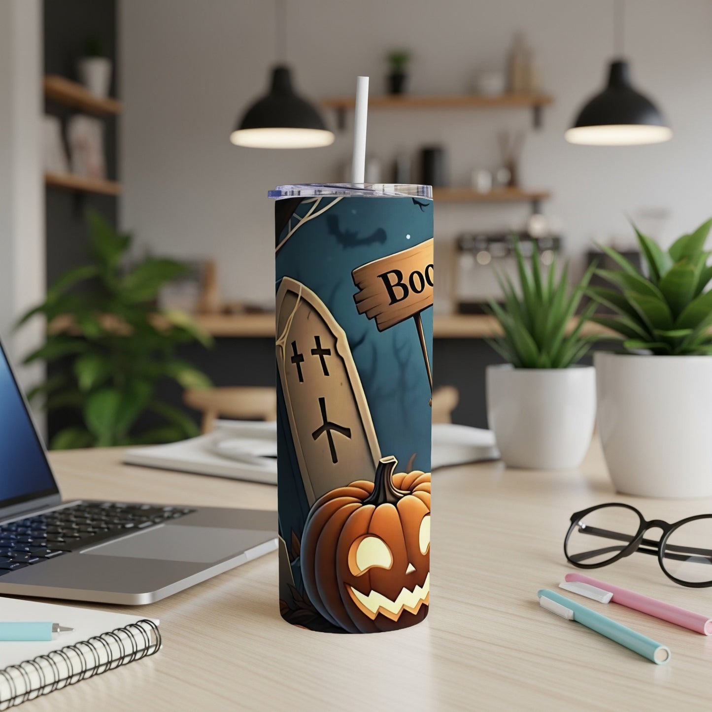 Tumbler with Halloween theme: jack-o'-lantern, tombstone, and "Boo" sign.