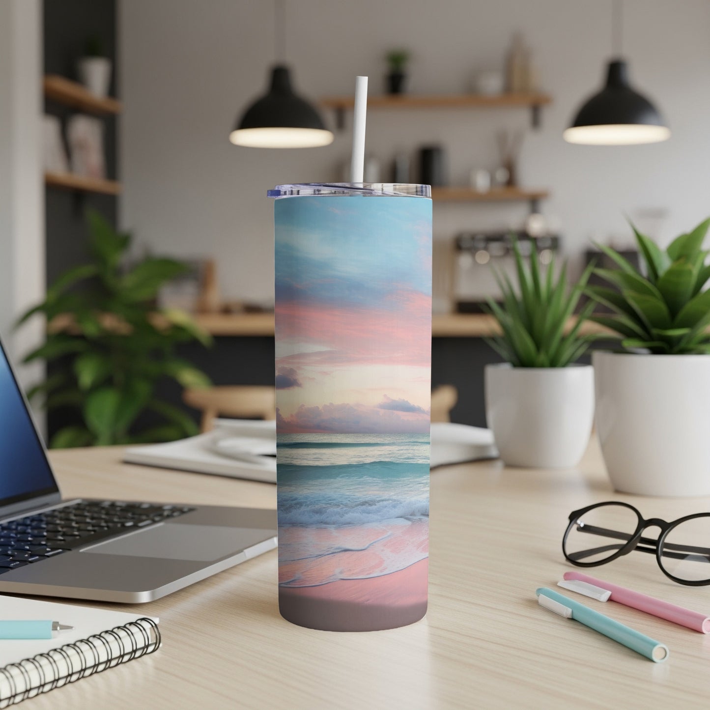 Ocean sunset beach scene on a double-walled tumbler with straw.