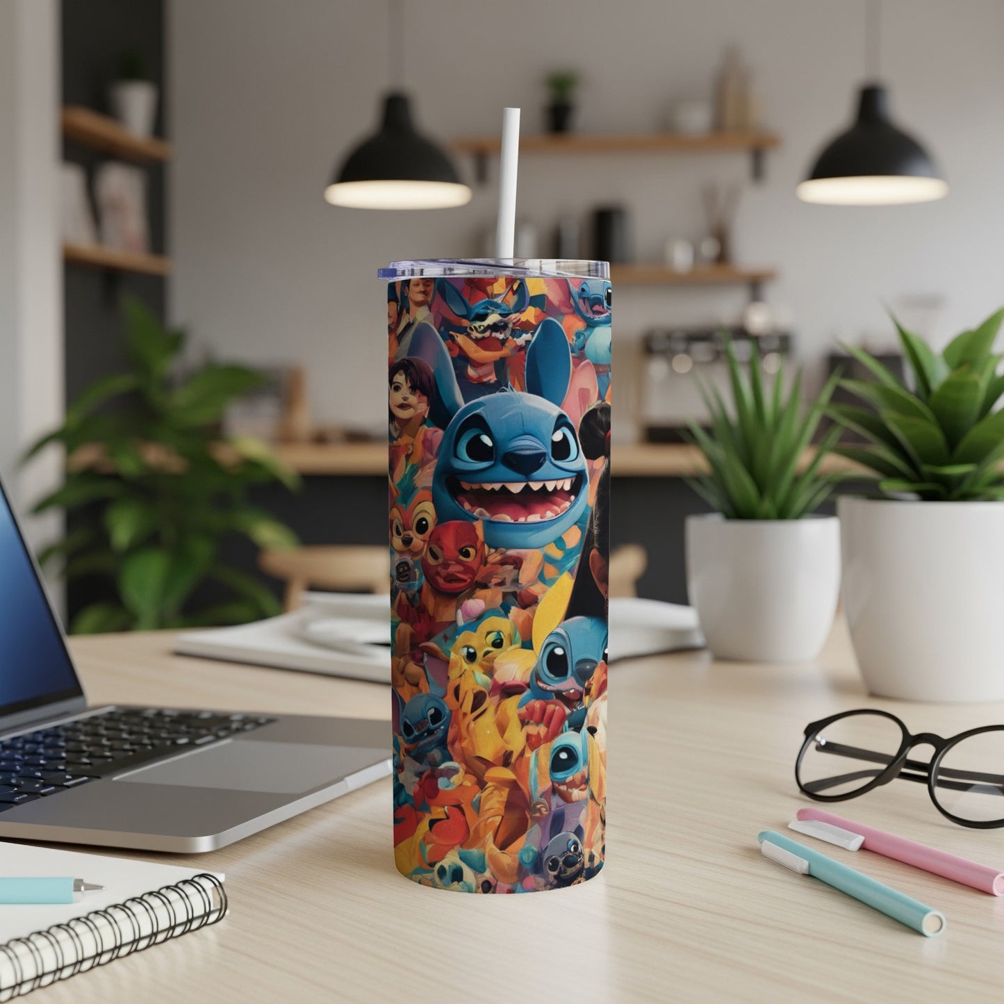 A colorful tumbler featuring Disney's Stitch and other characters, on a desk.