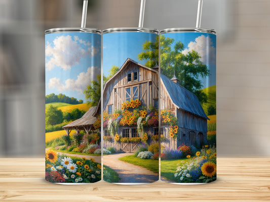 Barn with sunflowers and rolling hills under a blue sky.