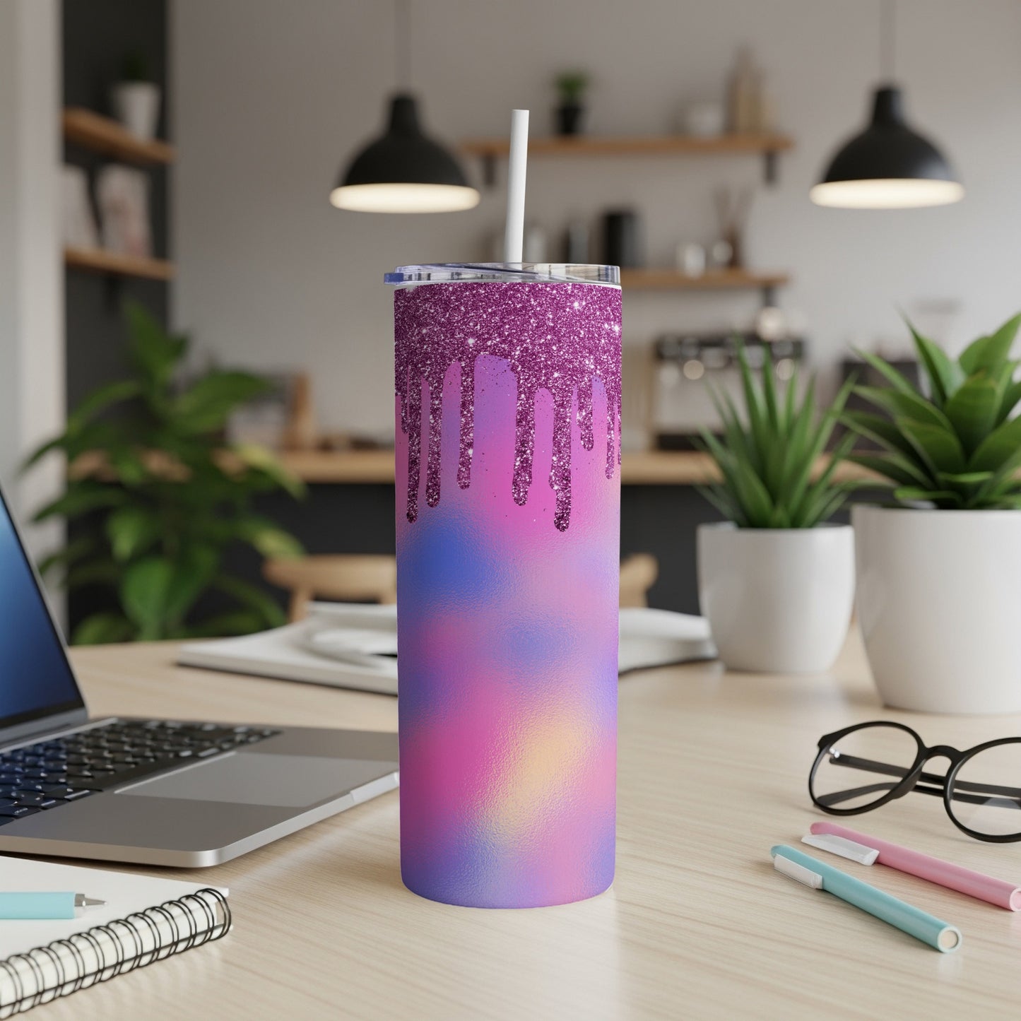 Glitter drip tumbler with purple glitter lid and abstract pink, purple, and blue design.