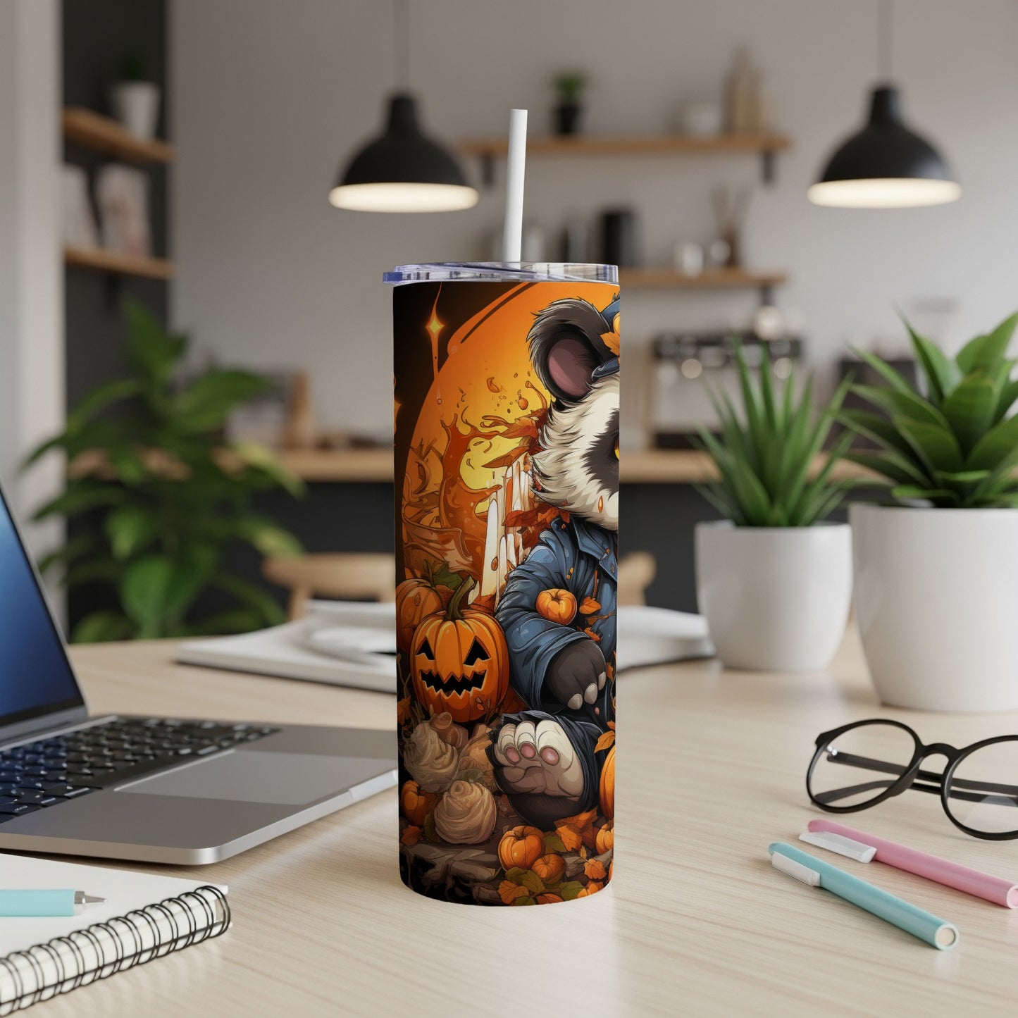 Halloween tumbler with raccoon character surrounded by pumpkins and autumn leaves.