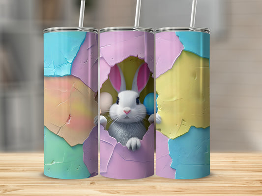 Easter bunny peeking from cracked egg with colorful pastel background.