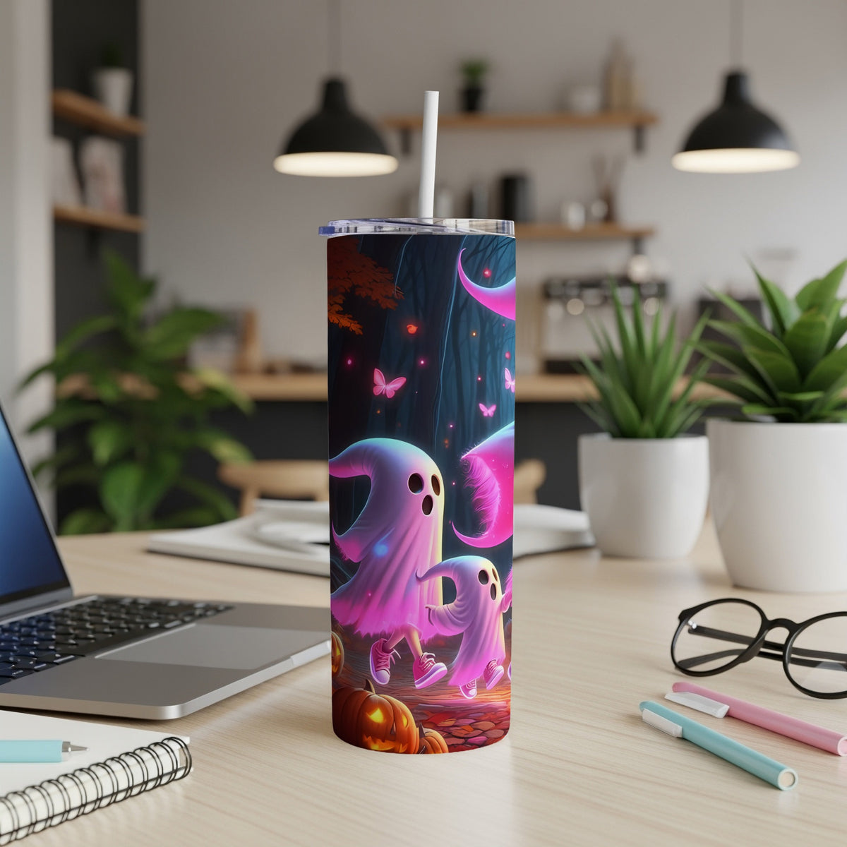 Halloween tumbler with pink ghosts, pumpkins, and butterflies in a forest scene.
