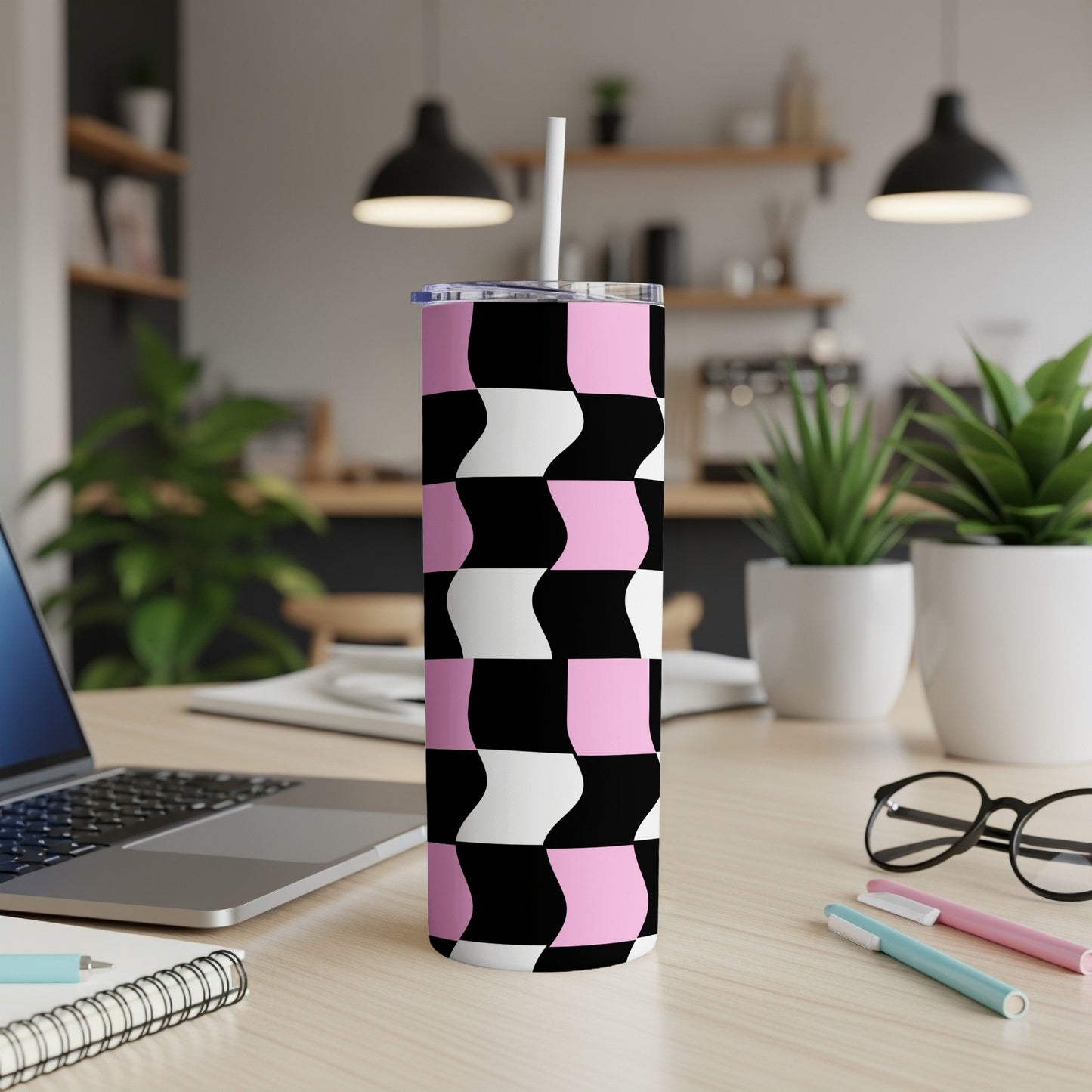 Tall tumbler with black, white, and pink wavy geometric pattern, straw inserted.