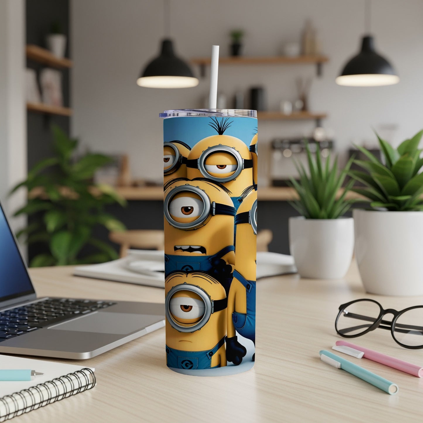 Minions with large eyes on a blue background, on a tall tumbler with a straw.