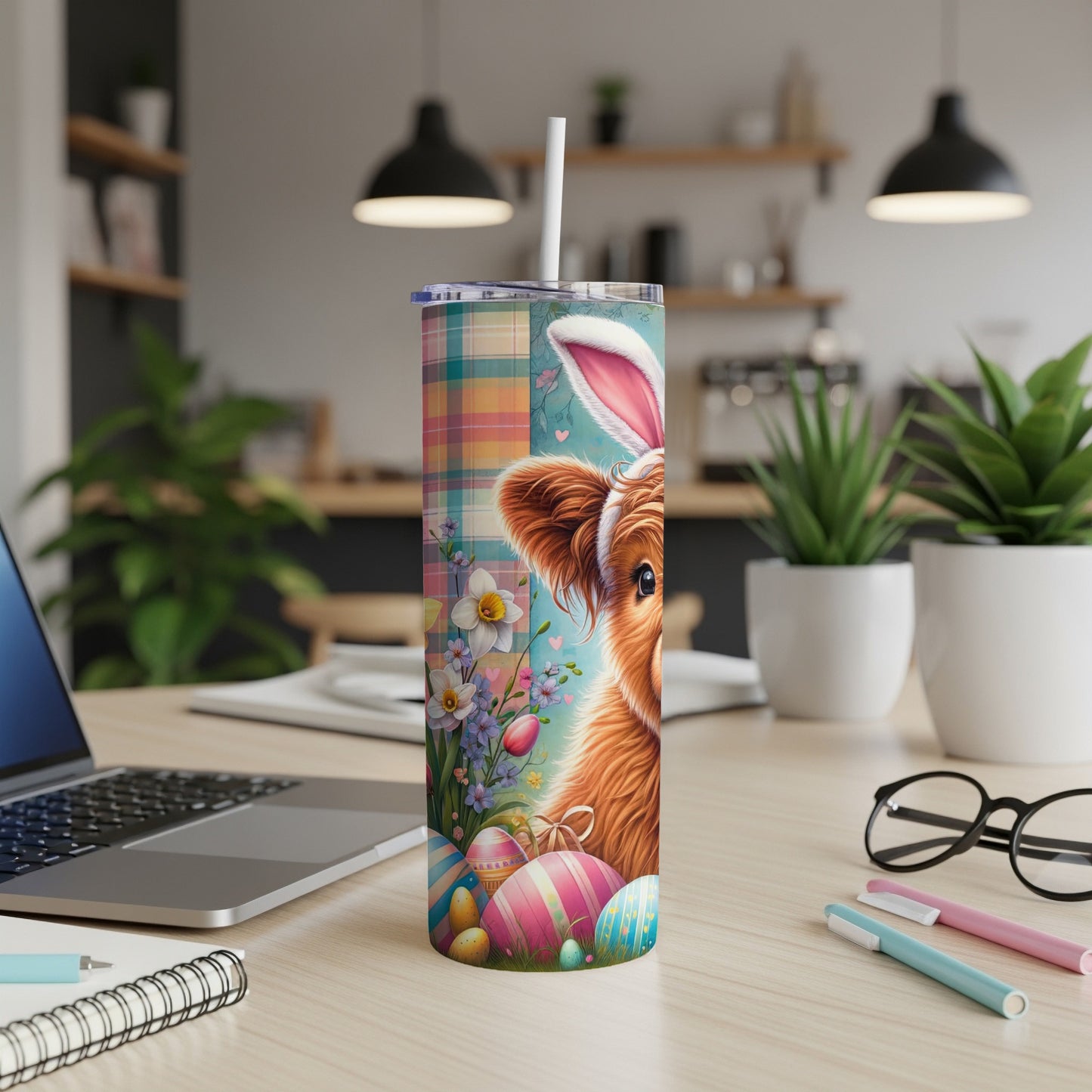 Easter Highland cow tumbler with colorful eggs and flowers.