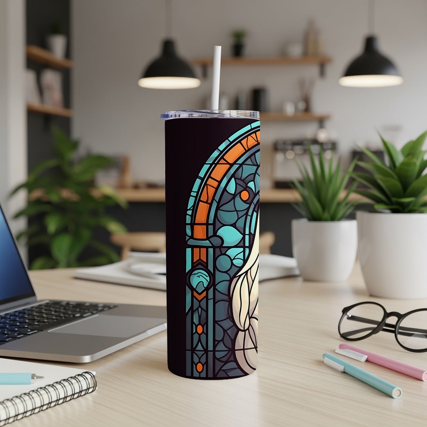 Tall tumbler with stained glass design featuring teal, orange, and blue geometric patterns.