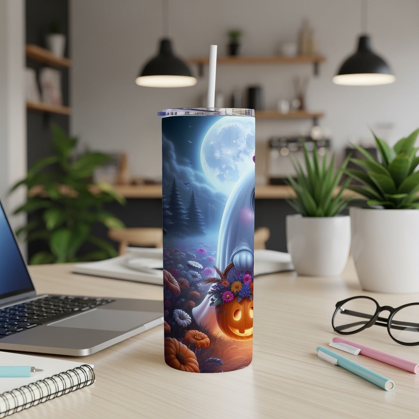 Tumbler with ghost, pumpkins, and moon on a Halloween scene.