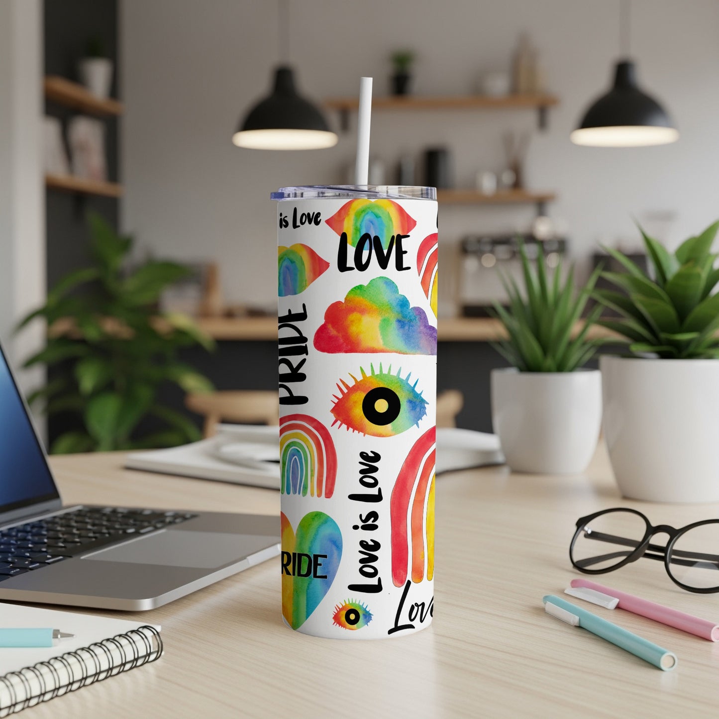 Pride rainbow tumbler with "Love is Love" text and rainbow patterns.