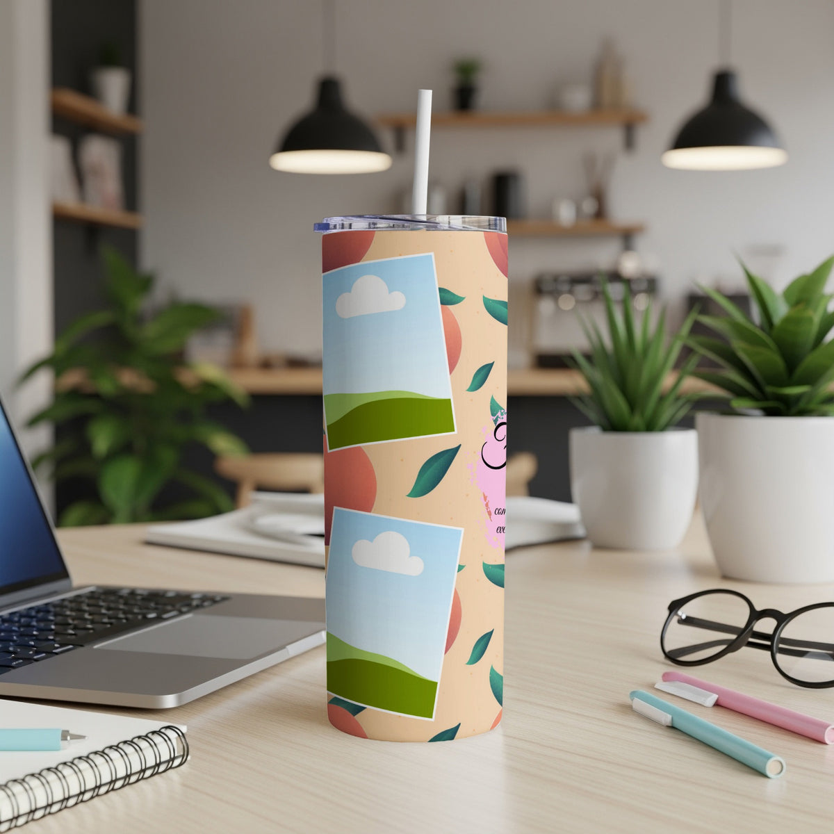 Tumbler with peach pattern, framed photos, and cartoon cat graphic.