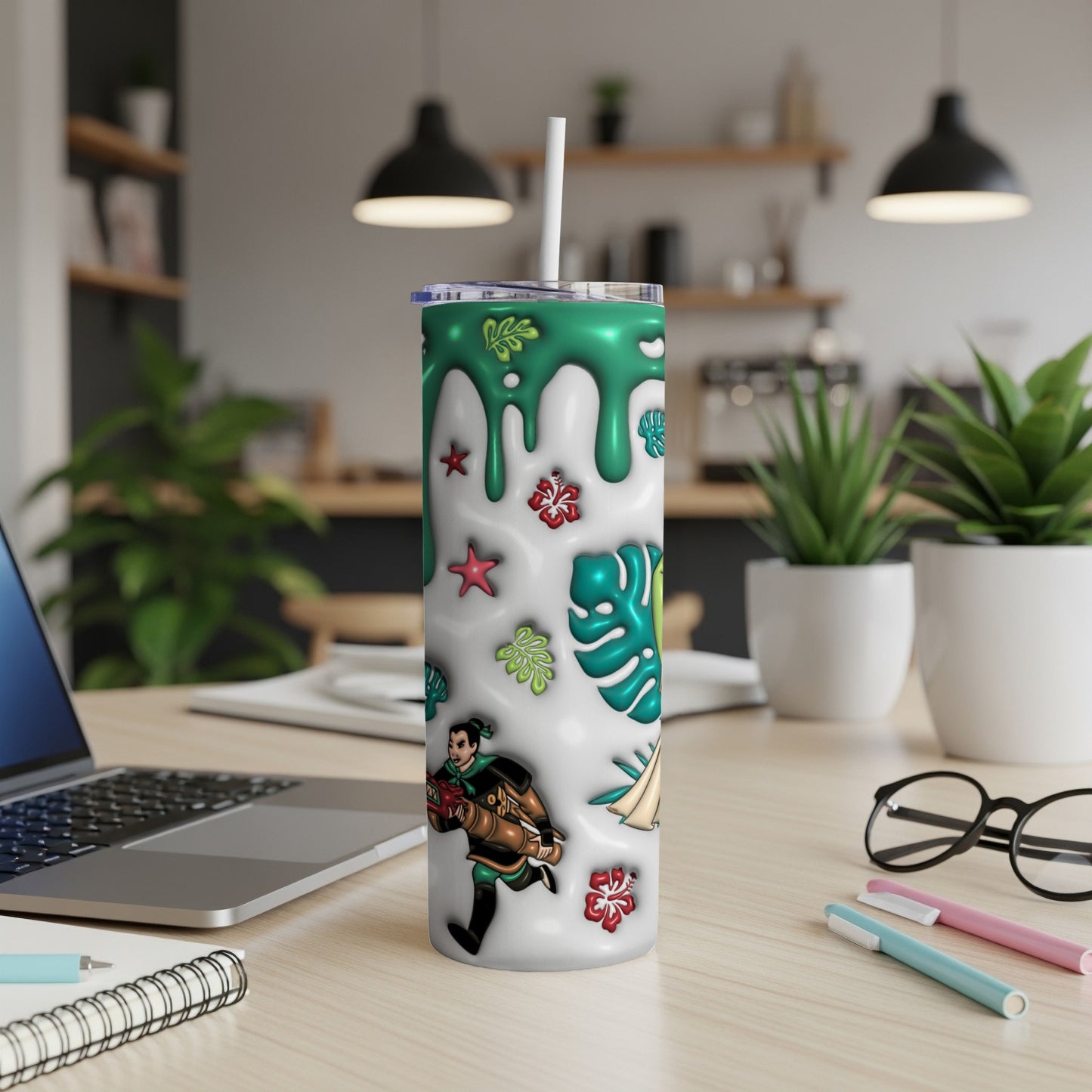 White tumbler with green drip, tropical leaves, and animated character.