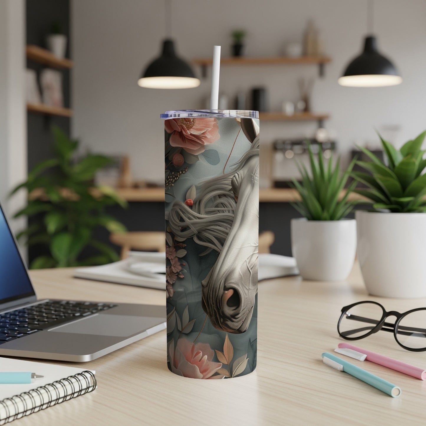 Close-up of a white horse's head with floral accents on a stainless steel tumbler.