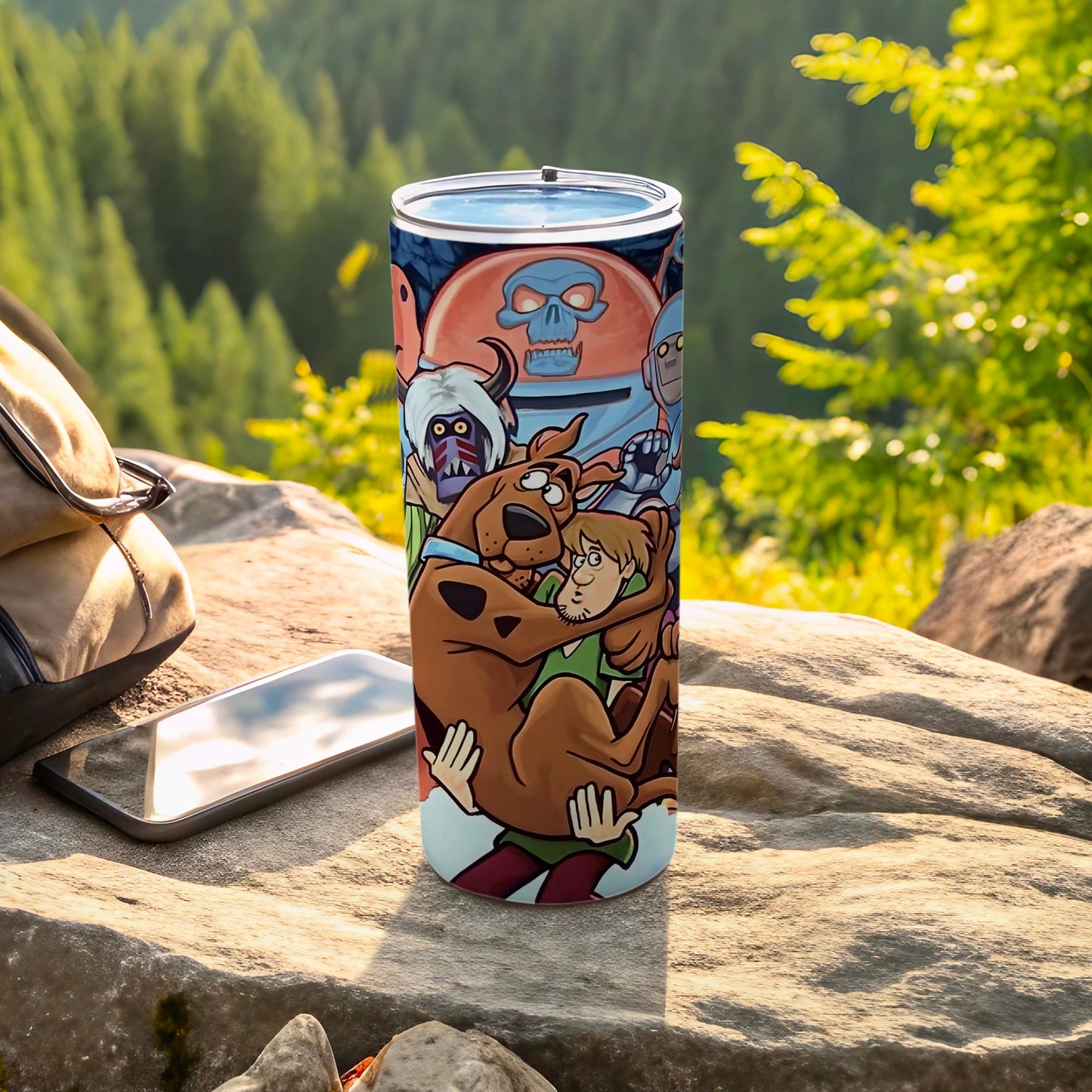 Scooby-Doo and Shaggy characters on a colorful tumbler with a mountain background.