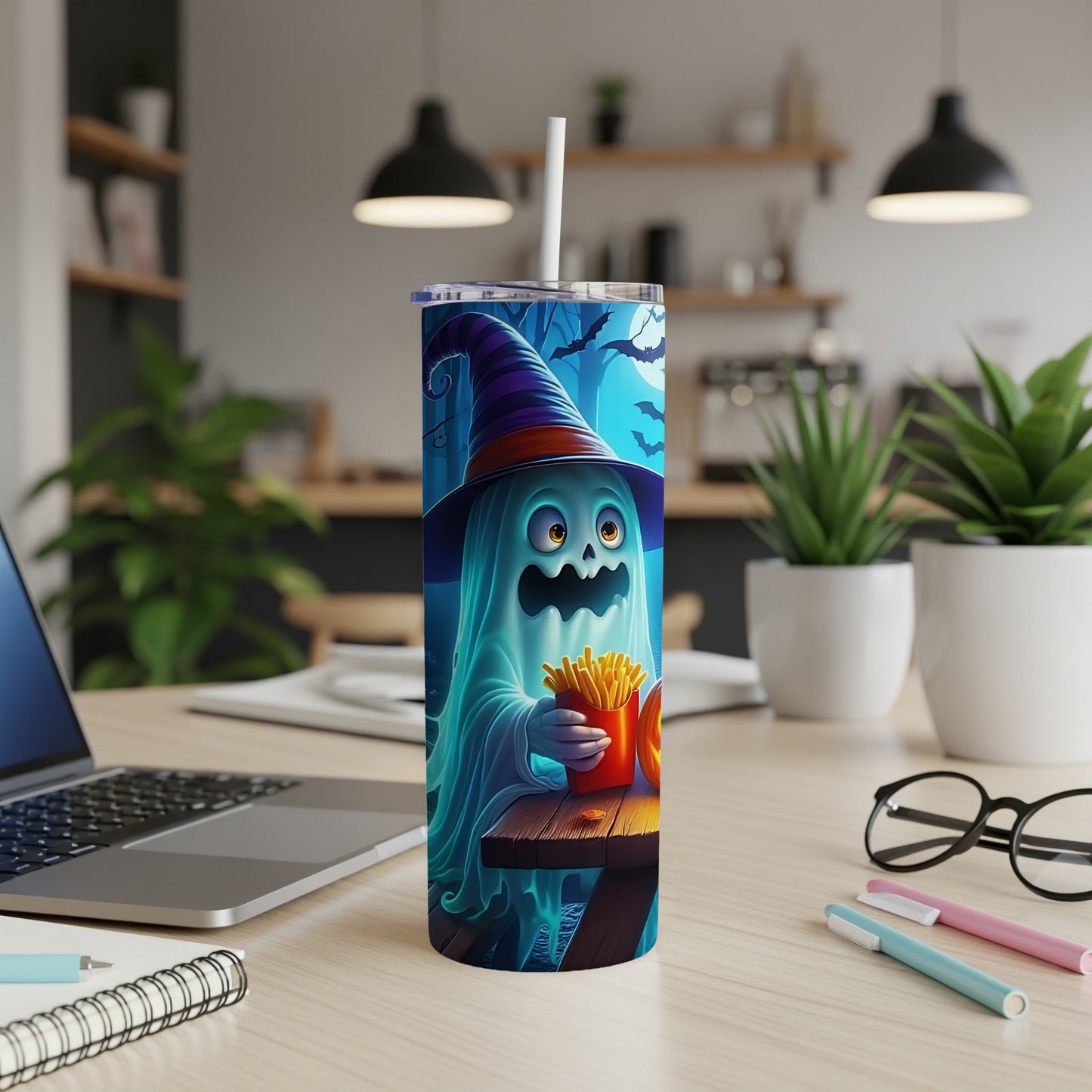 Halloween tumbler with a cartoon ghost holding french fries and a pumpkin.