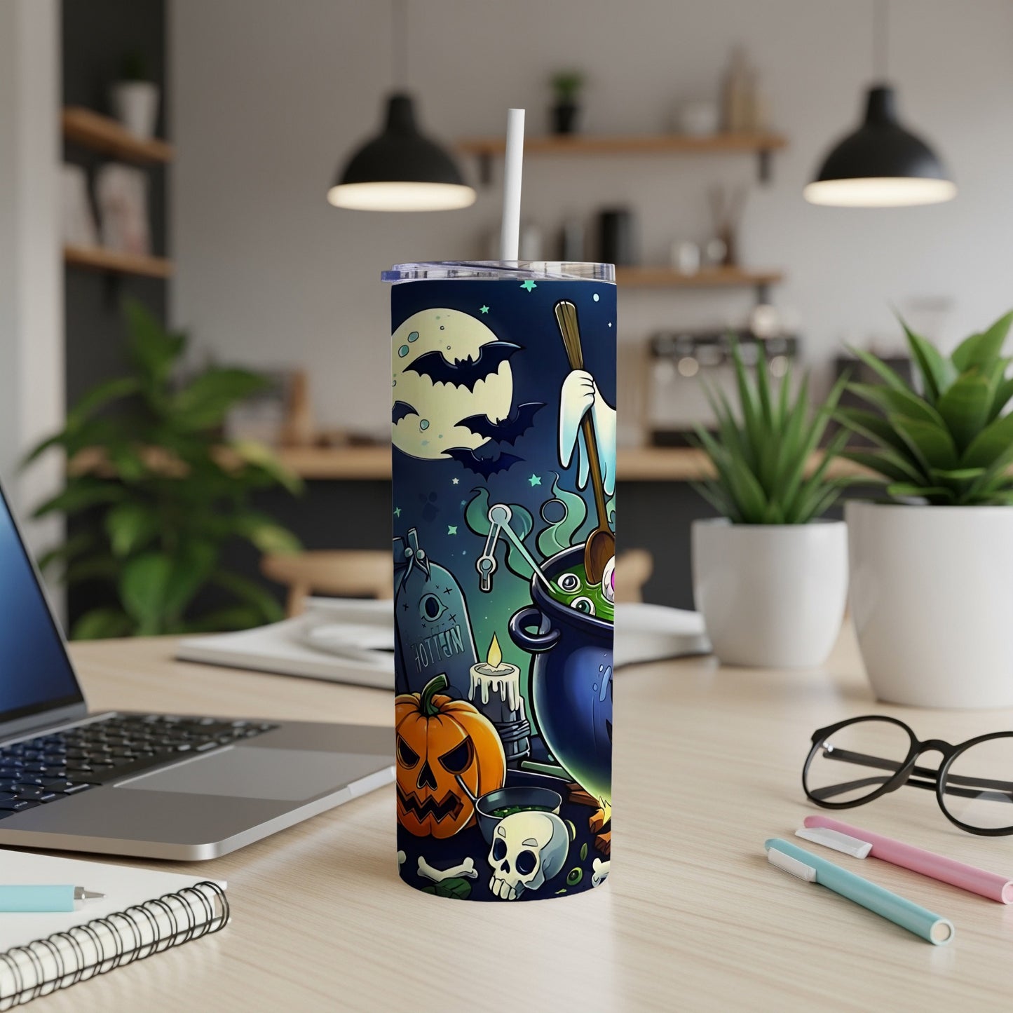 Halloween tumbler with jack-o'-lantern, skull, tombstone, and cauldron illustration.