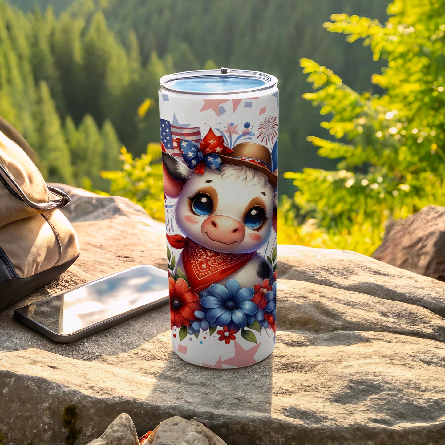 Patriotic cow tumbler with American flag accents and floral design.
