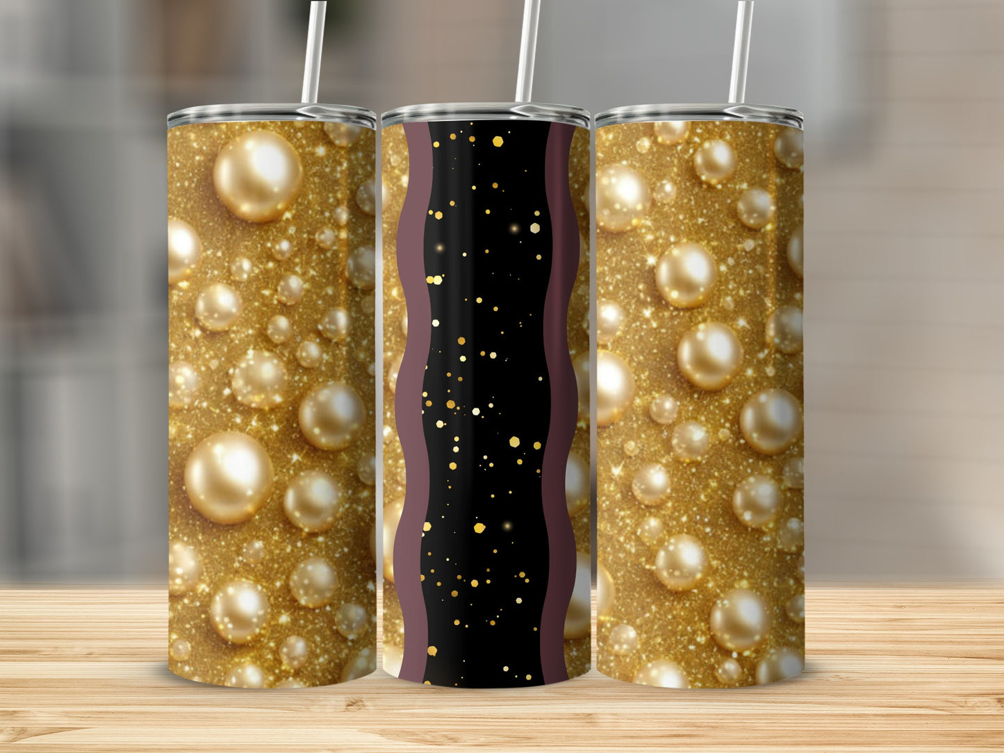 Three gold glitter tumblers with pearl-like orbs and a black wavy stripe.