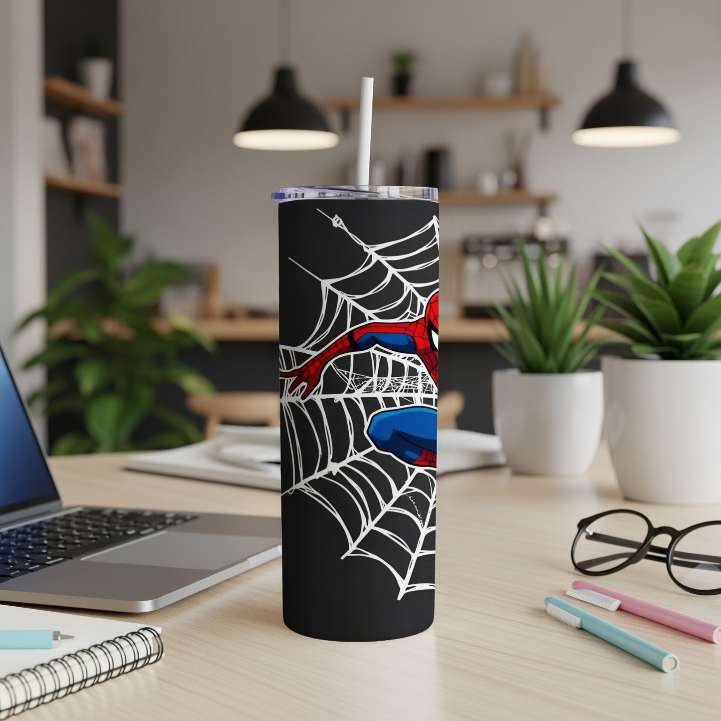 Black tumbler with Spider-Man web design and red-and-blue suit detail.