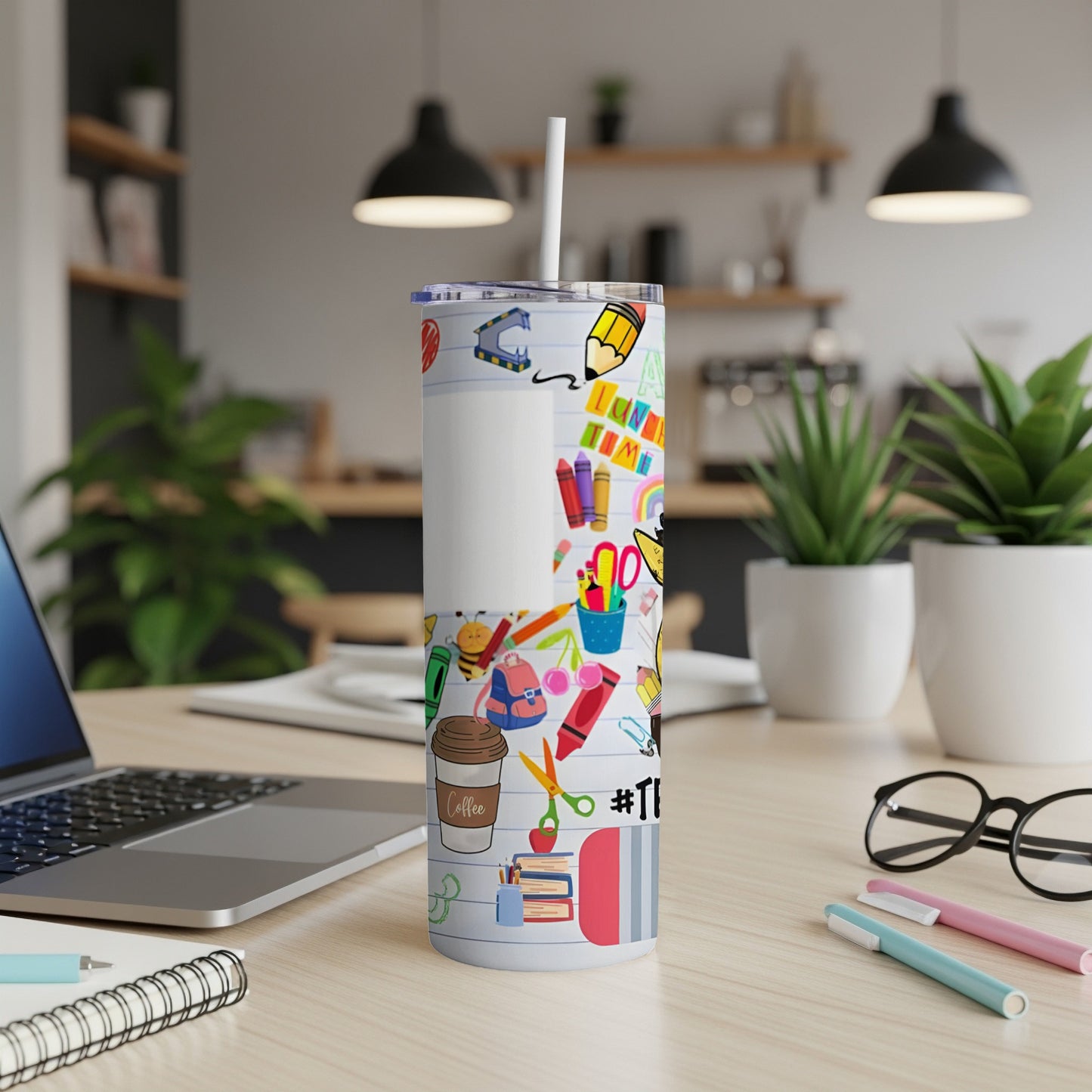 White tumbler with colorful school supplies design and "Teacher" text.