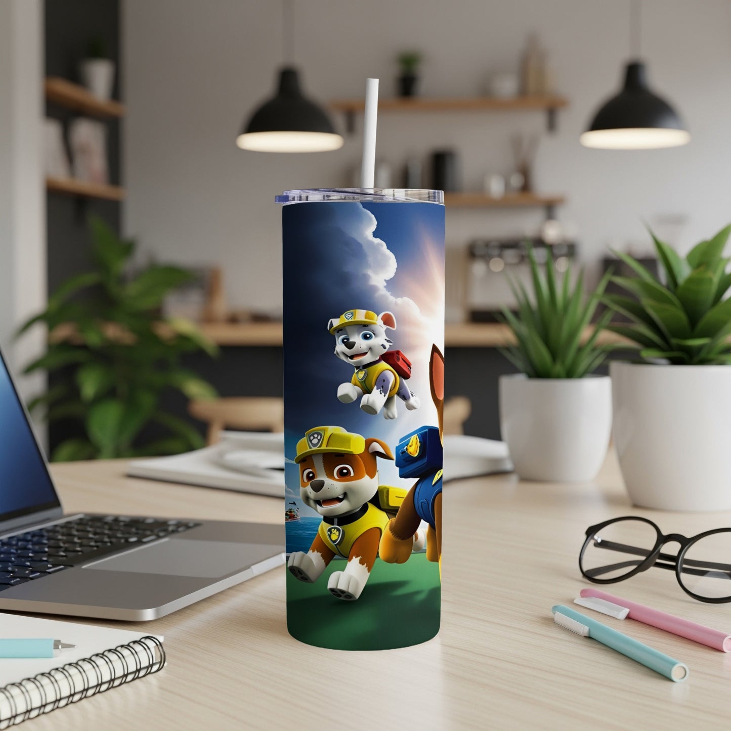Paw Patrol characters Chase and Marshall on a blue tumbler with a straw.