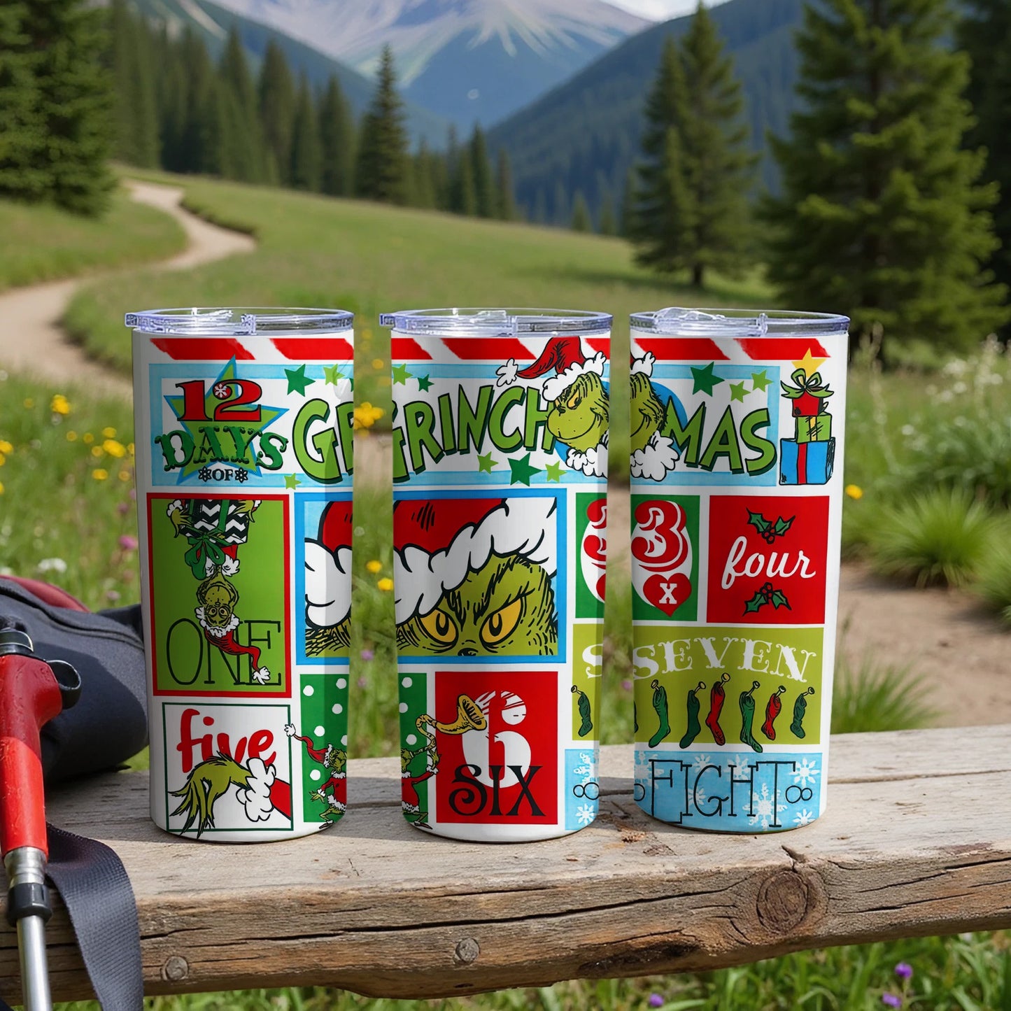 Three "Grinchmas" themed tumblers with numbers and holiday imagery displayed.
