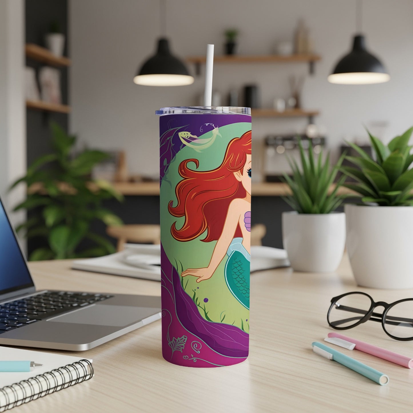 Ariel the Little Mermaid on a green and purple themed tumbler with straw.