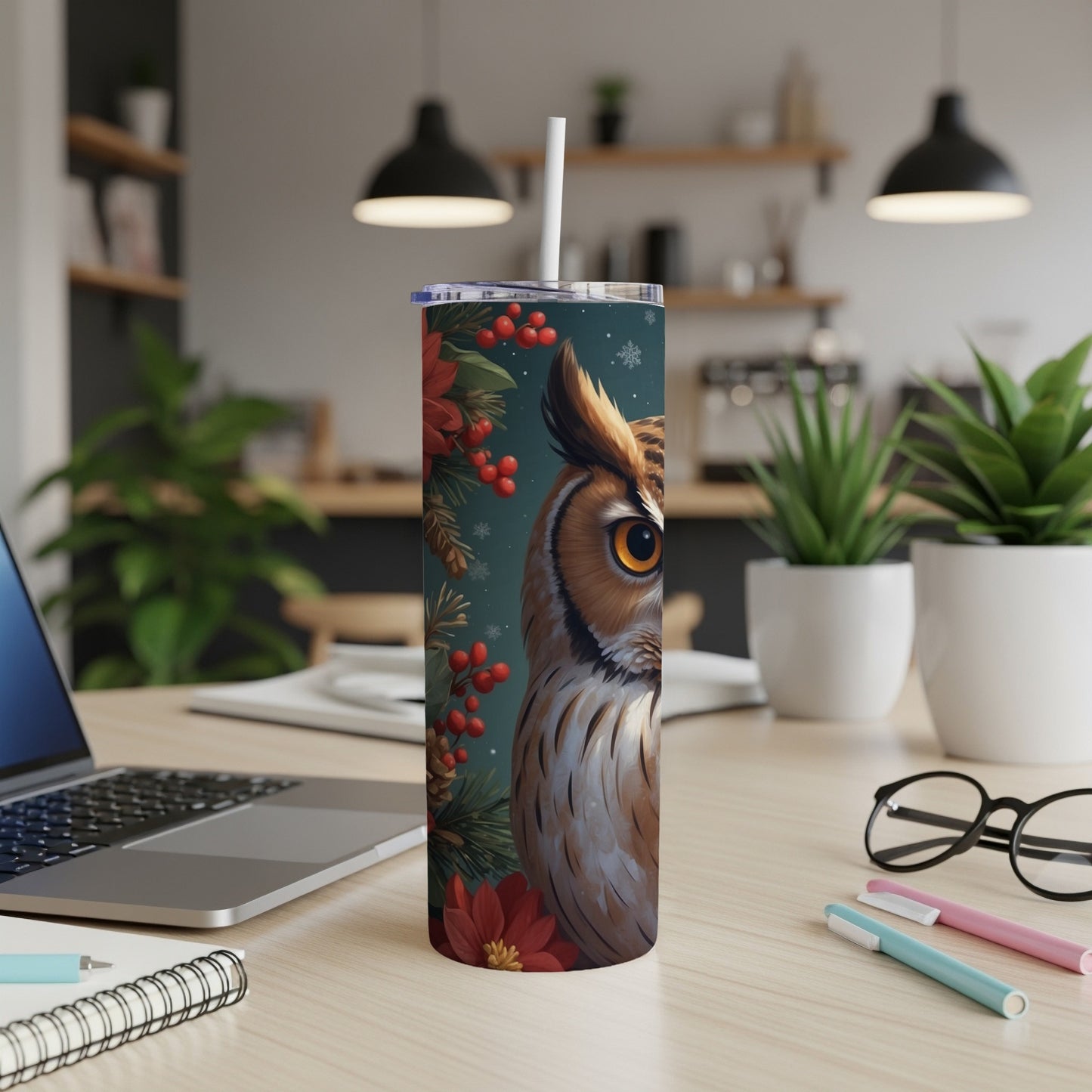 Owl and poinsettia design on a white tumbler with straw.