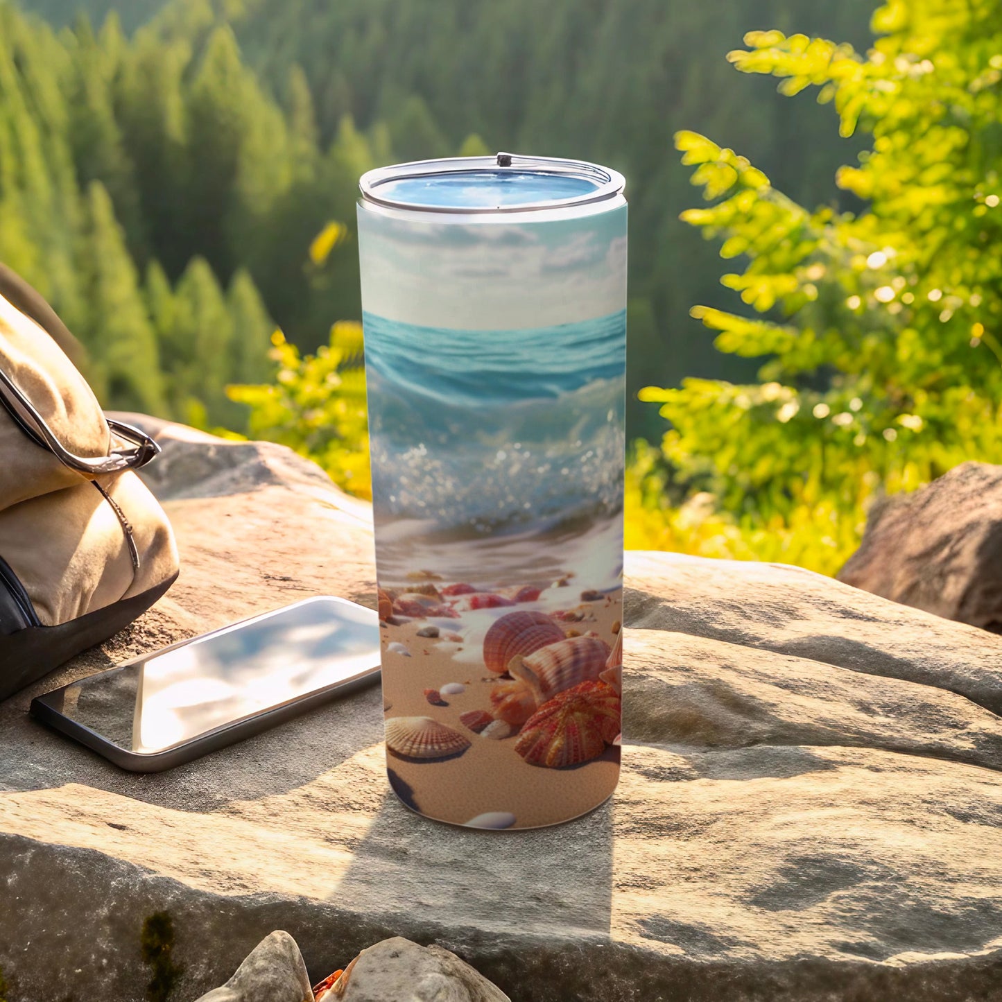 Tumbler with a beach scene and seashells.