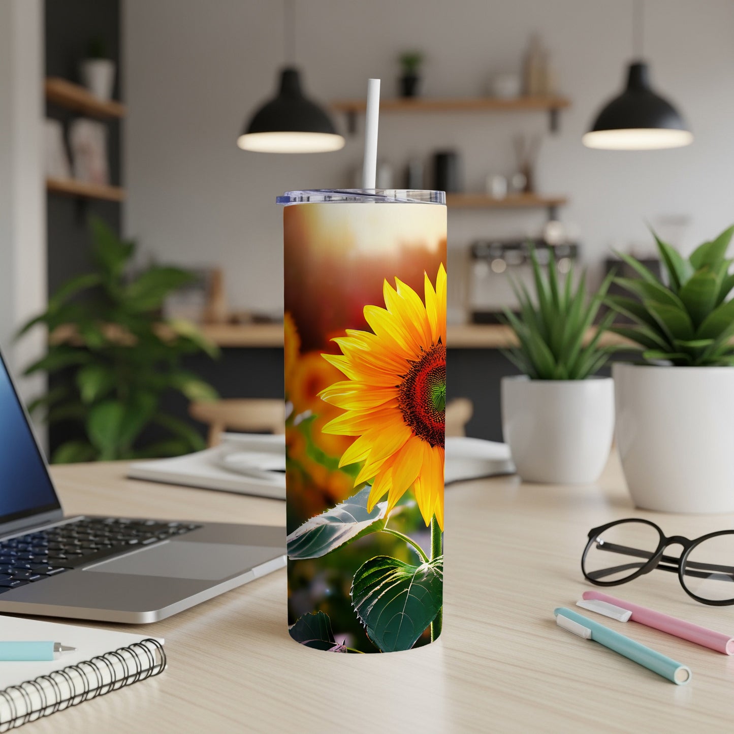 Sunflower design on a white tumbler with a straw.