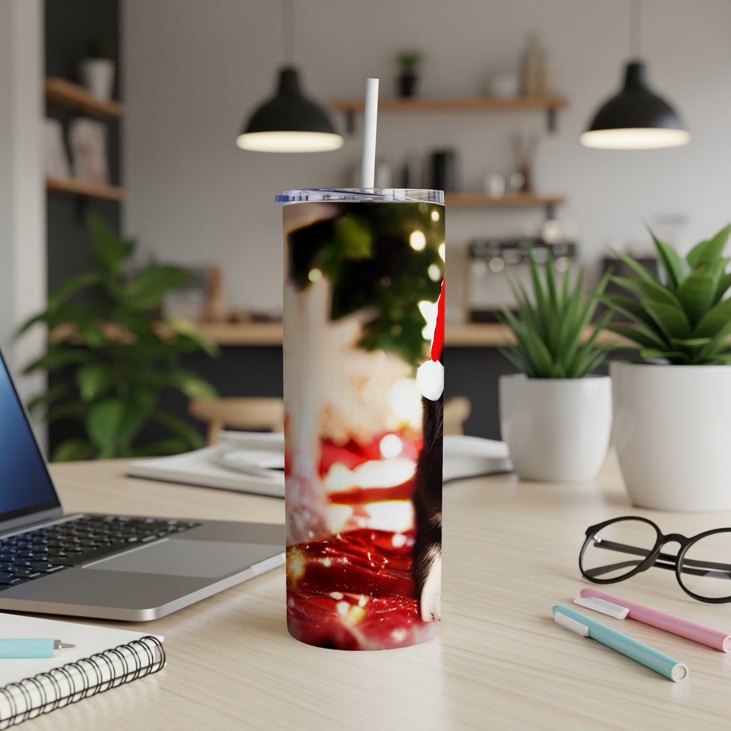 Christmas-themed tumbler with a cat wearing a Santa hat.