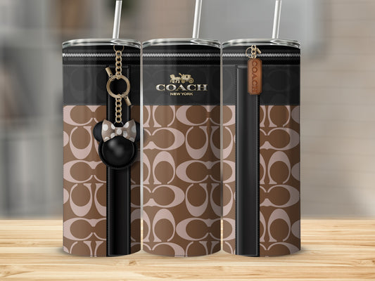 Coach logo tumbler with a brown and beige pattern and Mickey Mouse charm.
