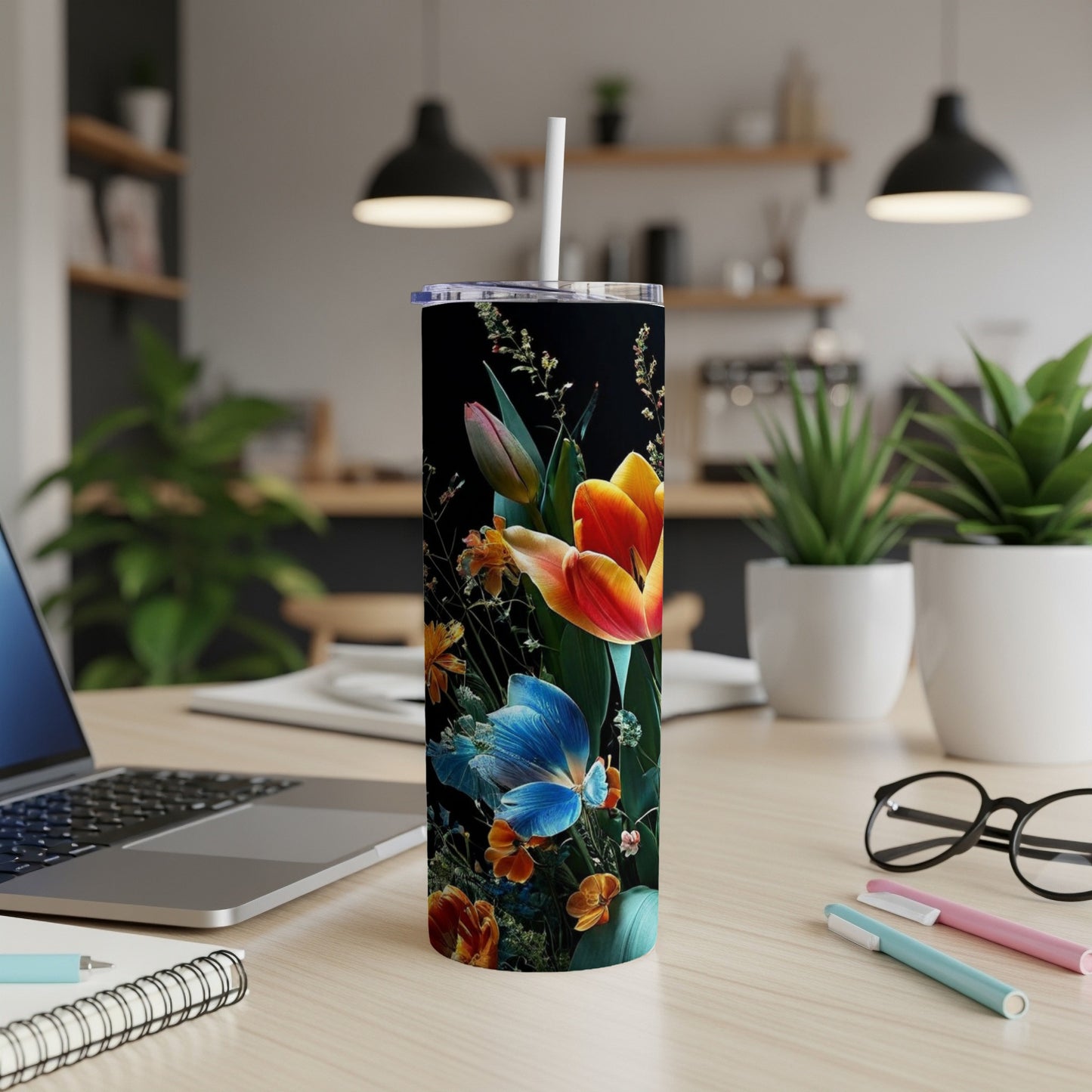 Tall black tumbler with vibrant floral pattern, featuring tulips and greenery.