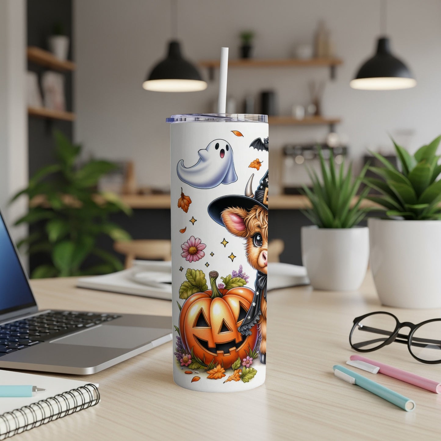 Halloween tumbler with a cow wearing a witch hat, ghost, and pumpkins.