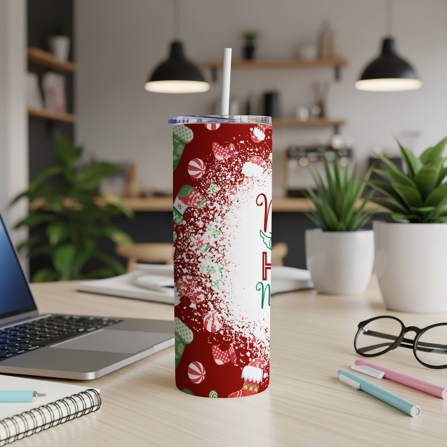 White tumbler with red and green Christmas cookie pattern and white straw.