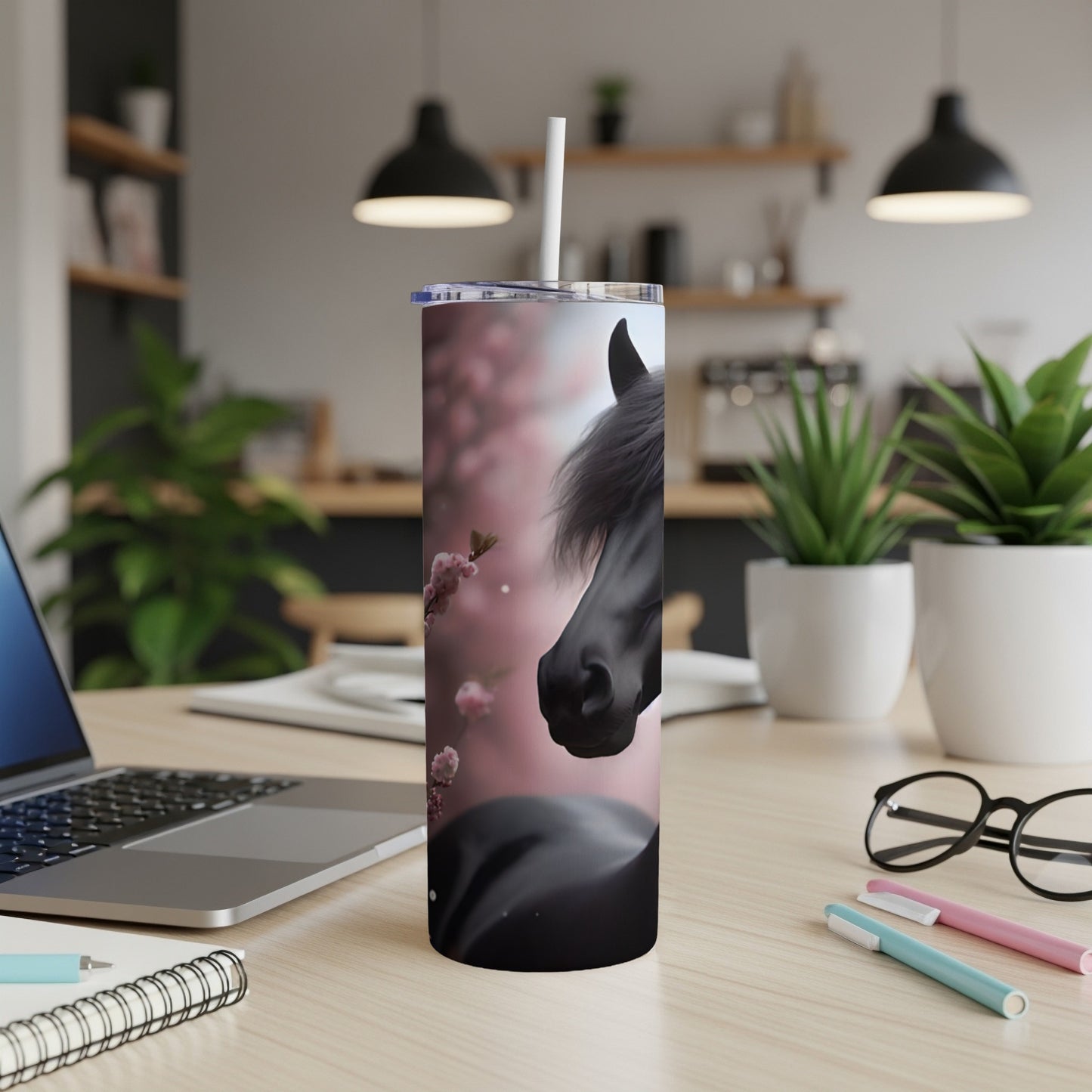 Black horse head and cherry blossoms on a skinny tumbler with a straw.