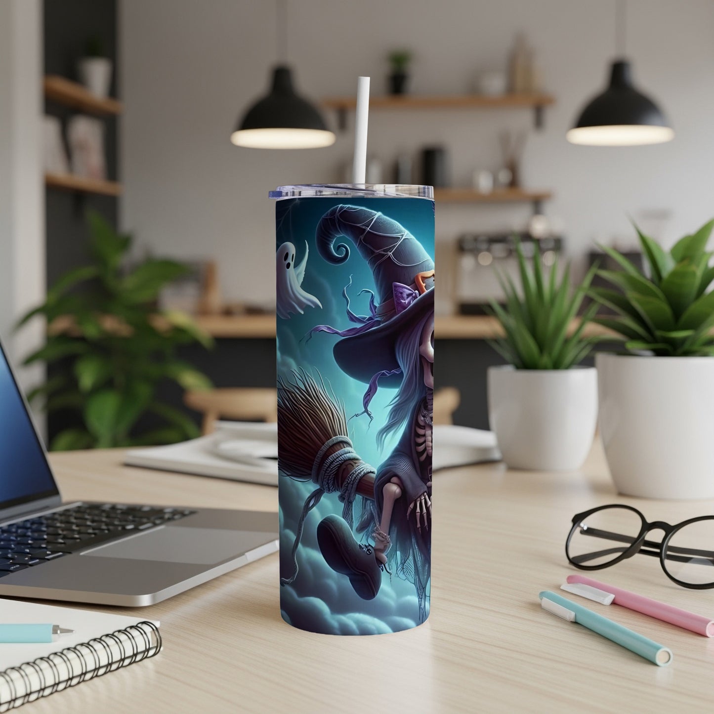 Tumbler with witch, broom, and ghost Halloween design.