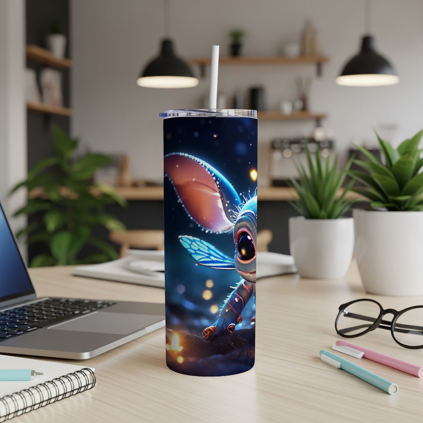 Cute alien creature with big eyes on a tumbler cup with a straw.