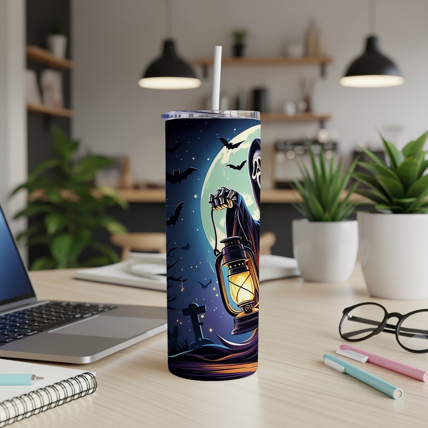 Tumbler with a spooky Halloween scene featuring a ghost holding a lantern.