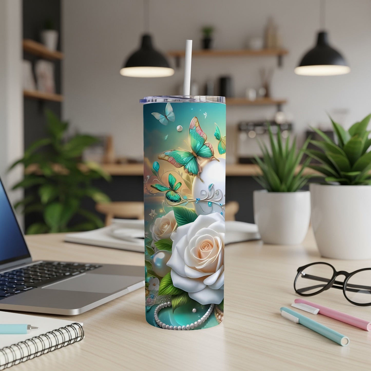 White rose and butterfly design on a tumbler with a straw.