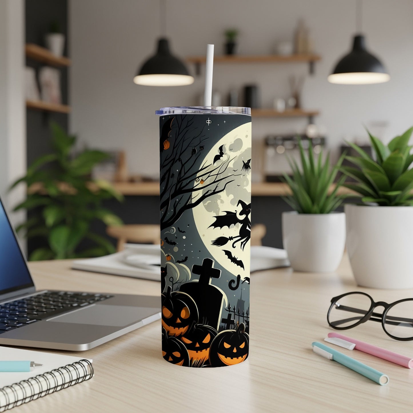 Tumbler with Halloween design featuring pumpkins, witch, bats, and a large moon.