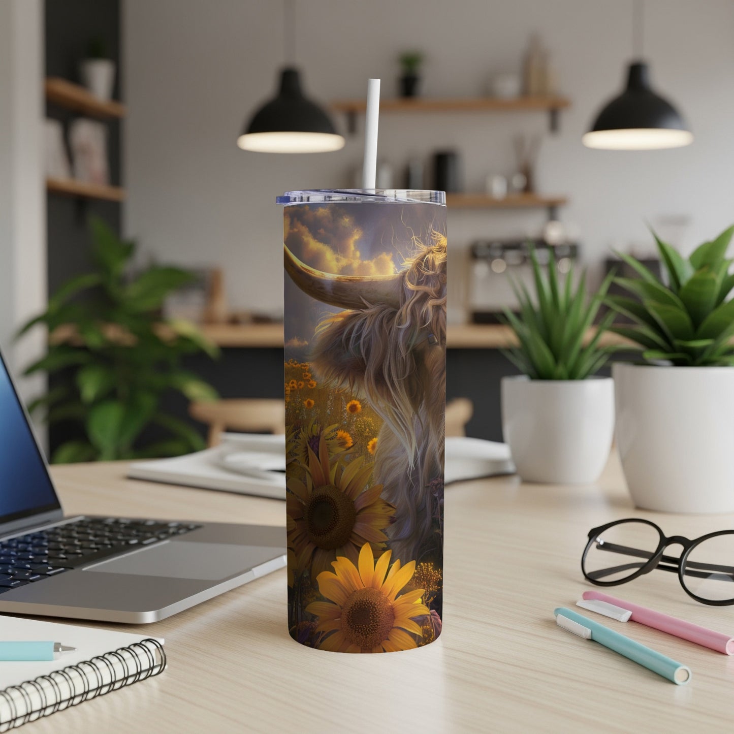 Highland cow among sunflowers on a white tumbler.