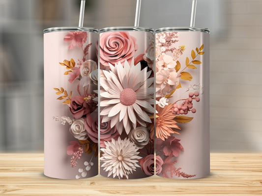 Three tall tumblers with floral designs in pink and white on a wooden surface.