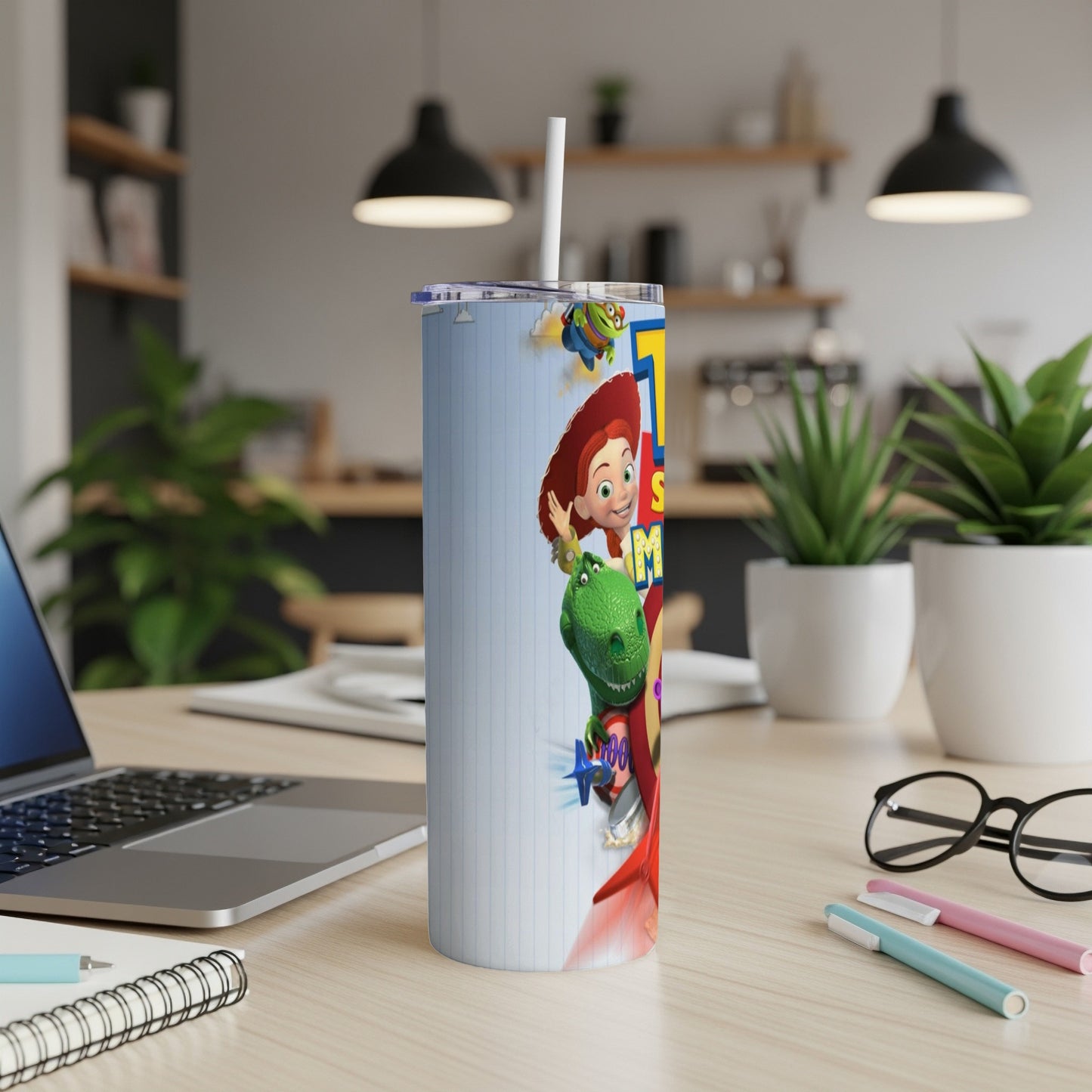 Toy Story characters Jessie and Rex on a white patterned tumbler with a straw.