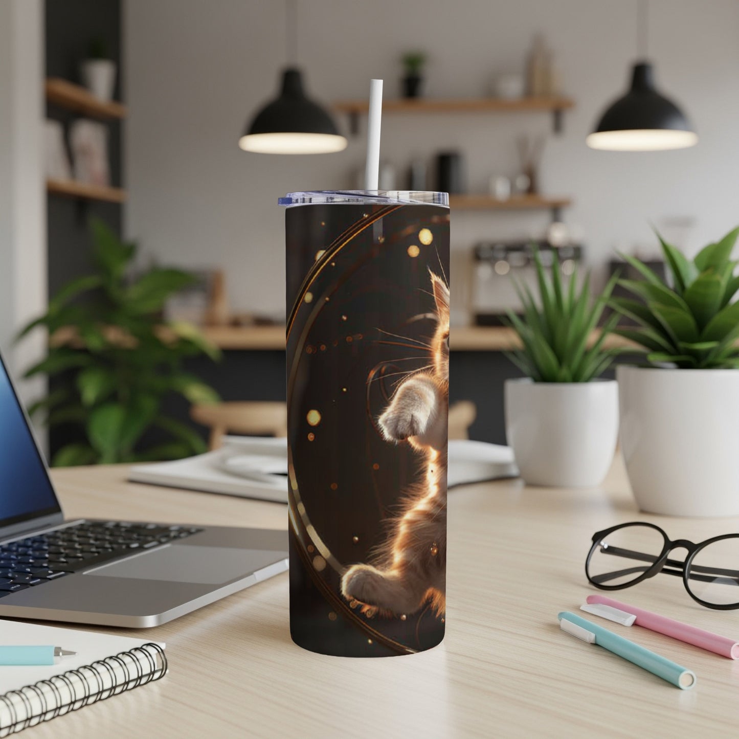 Tumbler with a fluffy orange cat design and gold accents.